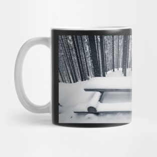 Wooden bench and table covered with snow among winter forest Mug